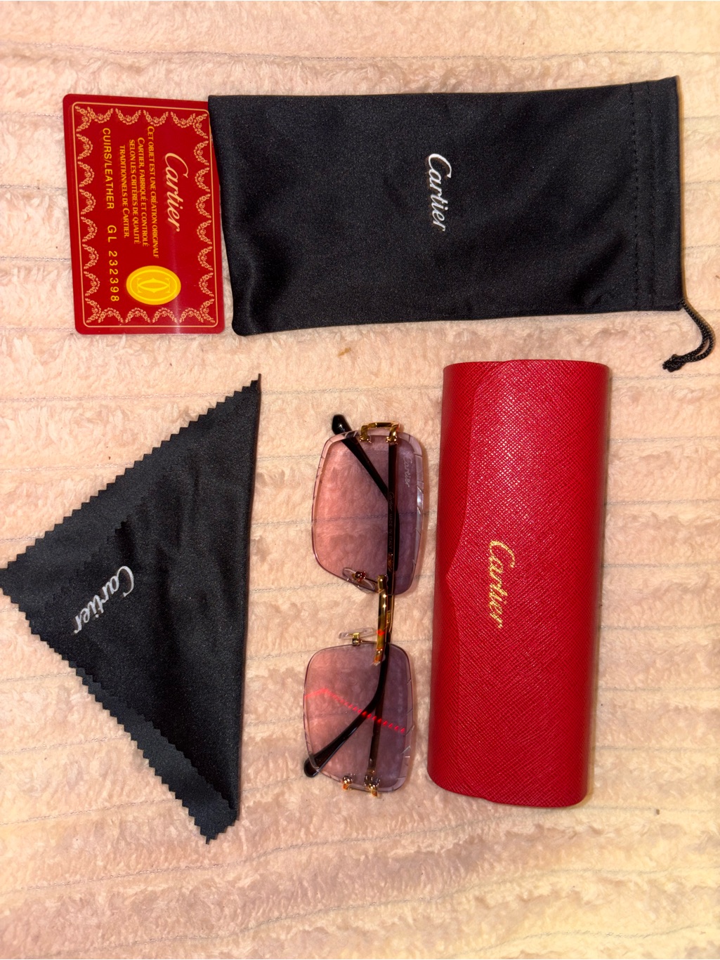 Cartier Gold Metal Rimless Sunglasses With Pink Background Accents